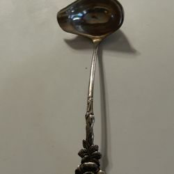 vintage Reed & Barton cream or sauce ladle from the "Harlequin" series, featuring the "Wild Rose" pattern.  Material: It is available in both sterling