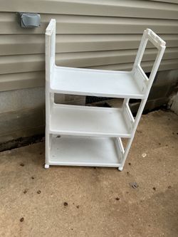 A strong, white shelf, 3 shelves (25” long x 14” wide x 39” tall)