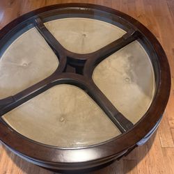 Coffee table with four hidden storage stools.