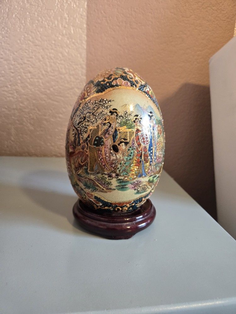 Asian ceramic egg  with stand