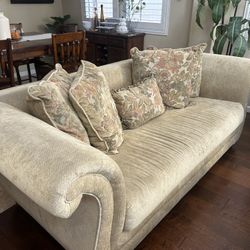 Elegant Sofa And Loveseat With Floral Pattern Pillows