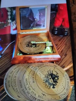 Christmas music box Mr. Christmas with 16 extra music disks. Glass top wood frame