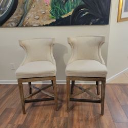 Pair of upholstered swivel counter stools