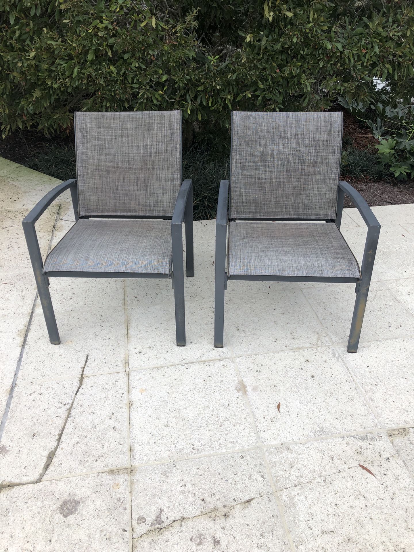 2 metal and mesh outdoor chairs