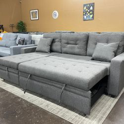 Gray Reversible Sectional with Pull Out Bed Ottoman