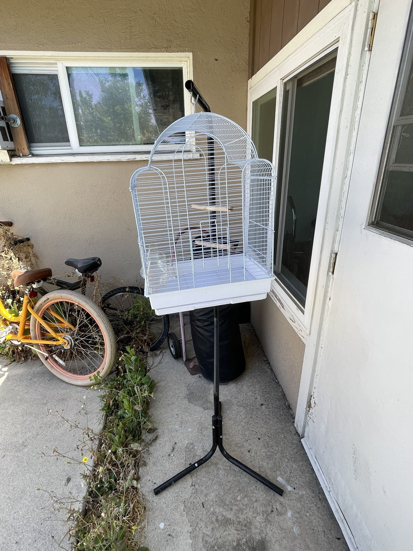 Bird Cage With A Stick That Can Hold The Cage