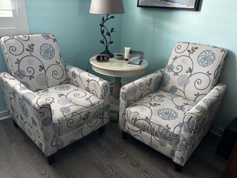 2 chairs with foot rests