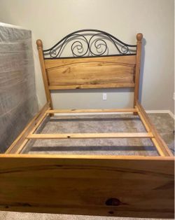 Wooden queen size bed with Mattress set still in plastic.