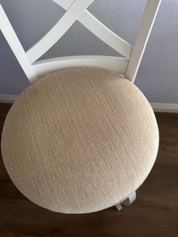 Two white wood counter height barstools