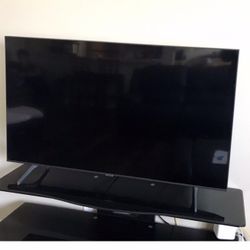 50” LG TV With 52” W x 15” D 3 Shelf  Black Glass TV Stand 