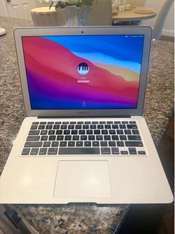 Silver MacBook Air with Charger