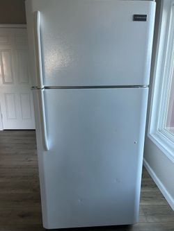 White Frigidaire refrigerator with the top freezer