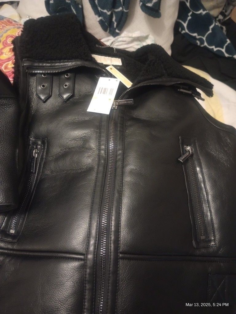 Black Michael Kors handbag and vest to match!