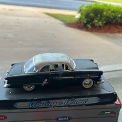 Welly 1:24 scale diecast model of a 1953 Ford Crestline Victoria in black.