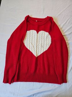 red sweater features a cable-knit white heart in the center size L