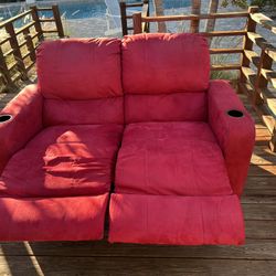 Red reclining loveseat couch with cupholders