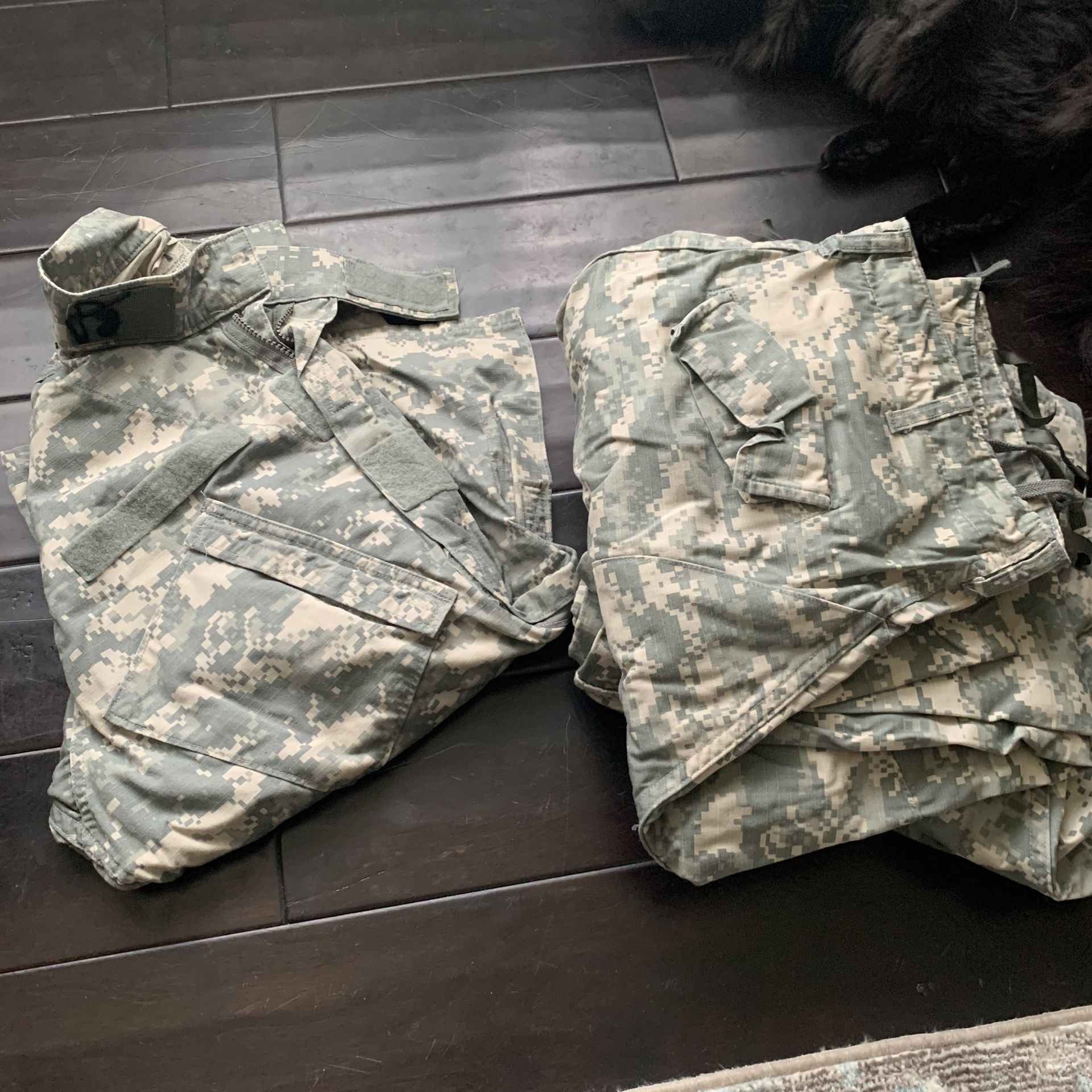 Military fatigues and duffle bag