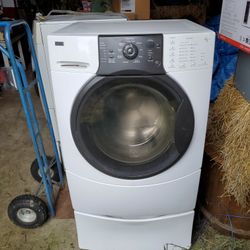 Kenmore elite White washer dryer set with pedestals..