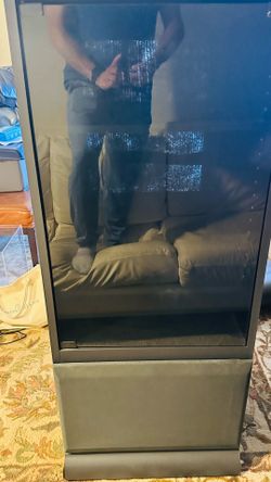 Black media cabinet on wheels