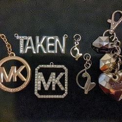 Seven Different Name Brand Pendants And Keychains