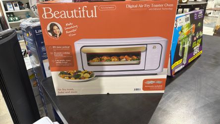 Beautiful Infrared Air Fry Toaster Oven features a sleek white icing finish and 10 preset cooking functions.