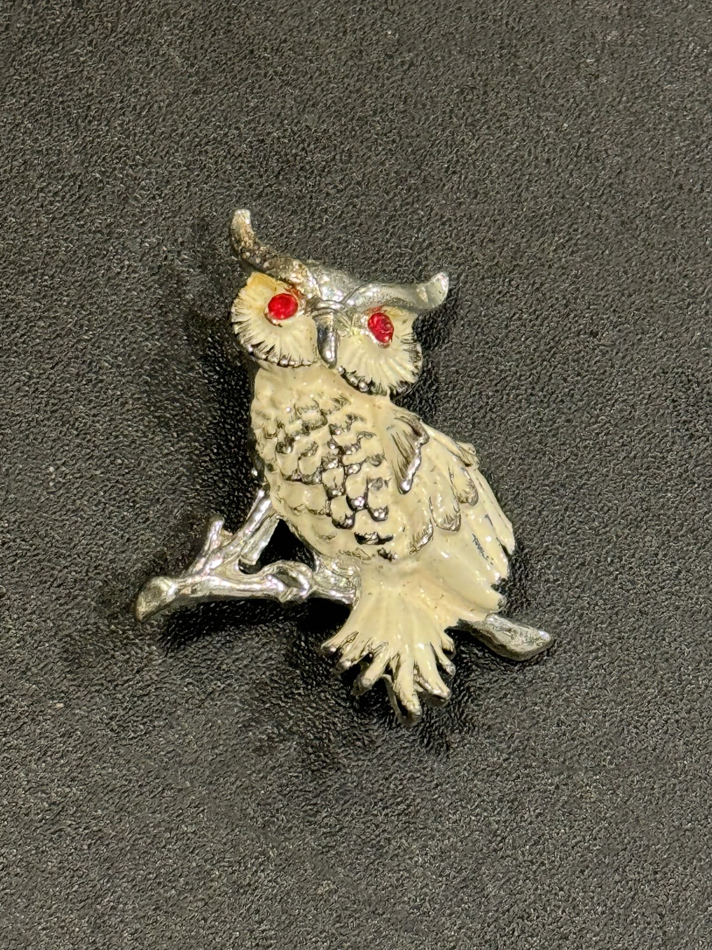 Vintage Owl pin with Ruby color jeweled eyes. 1-1/2” length.