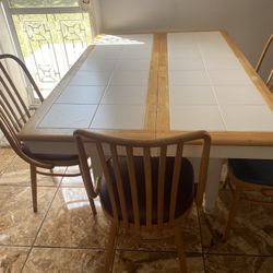 Kitchen Table . That Opens Up Into 12 Seater 