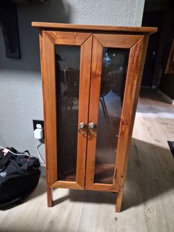 Cute small brown shelving cabinet