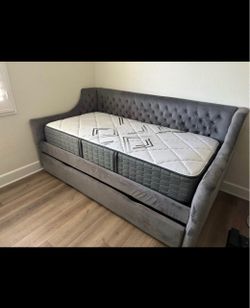 Twin bed frame and mattress storage space at the bottom