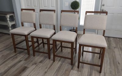 Four beautiful mid-century  counter height bar stools