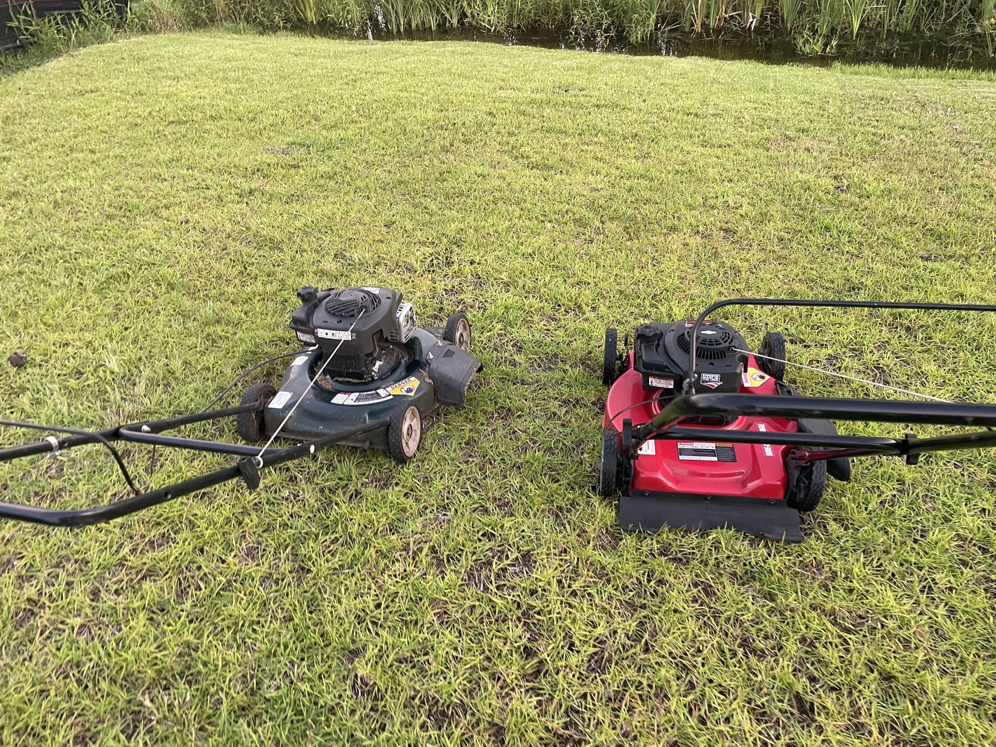 Two Gas Lawn Mowers Works