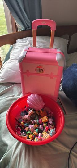 Girls Carrying Suit Case And Toys