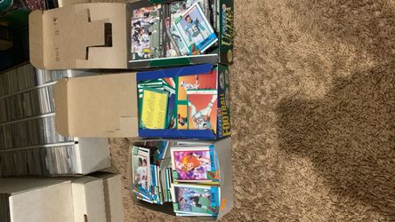 3 boxes full of football cards