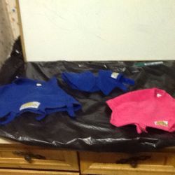 Three different sizes of pet snuggies.