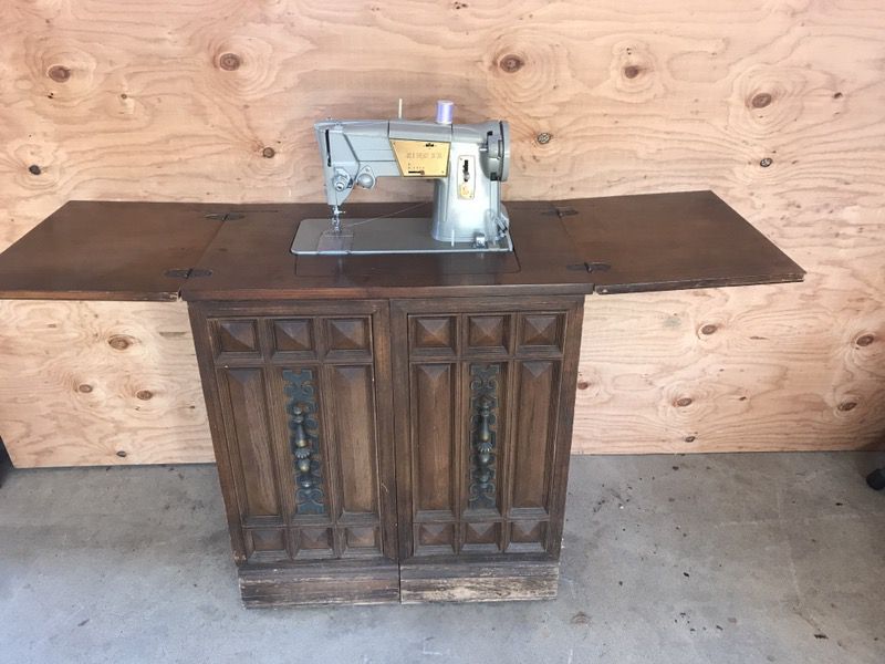 Antique Singer machine and cabinet
