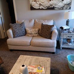 Cream Colored Sofa And Loveset With Pillows 