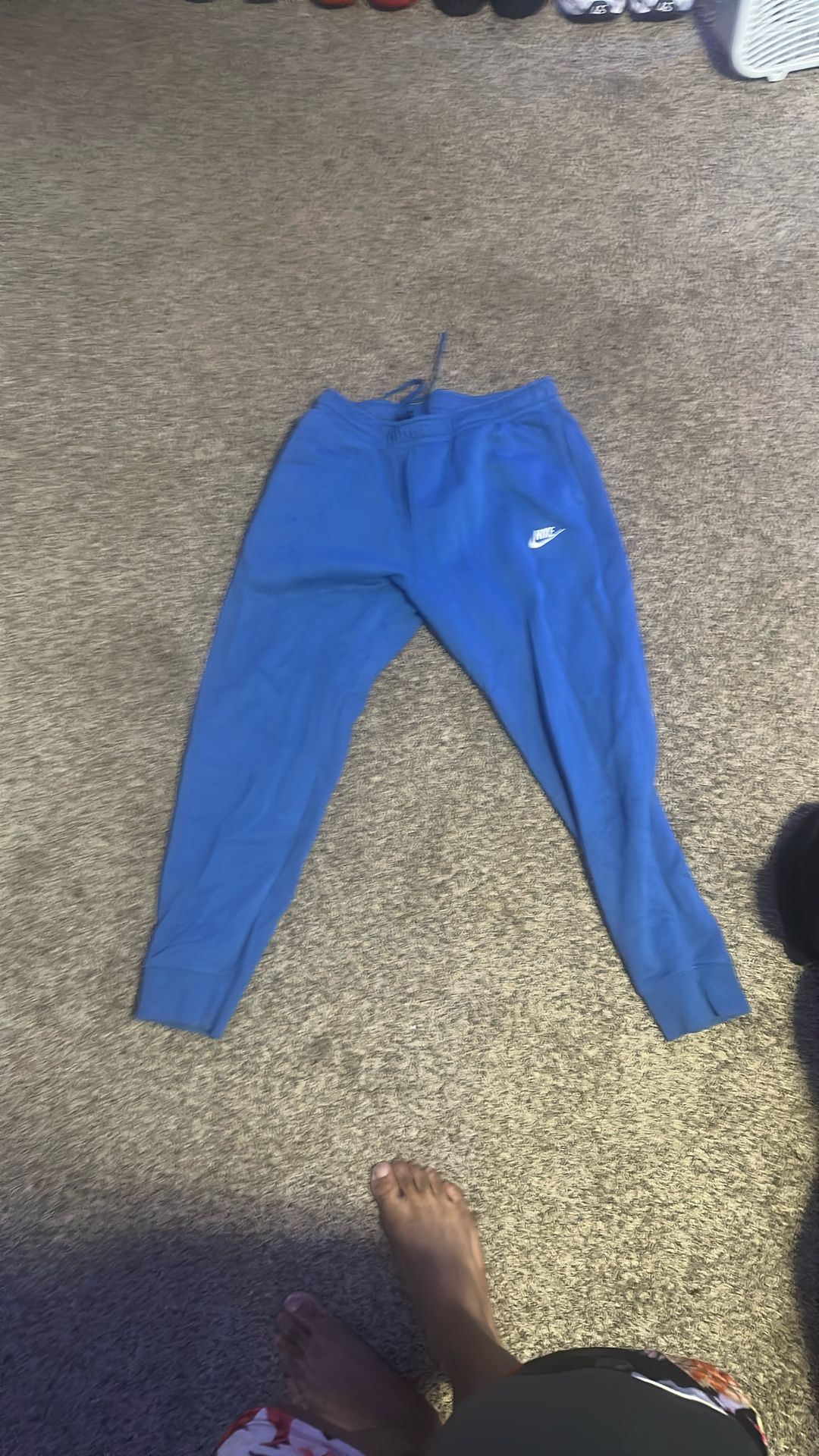 Blue Nike Joggers Size L can fit A Medium 