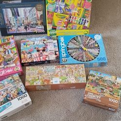 Lots Of 1000 Piece Puzzles And One 500 Piece Puzzle