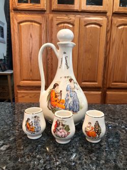 Vintage Pottery Pitcher With Stopper with 3 cups.  Size 10 inches Tall .  In the pitcher it says “Recuerdo de Guanajuato”.  Preowned Good Condition No