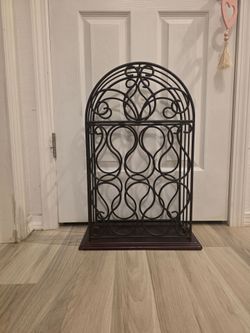 Ornate 24" tall wine holder, holds 10 bottles, $25
