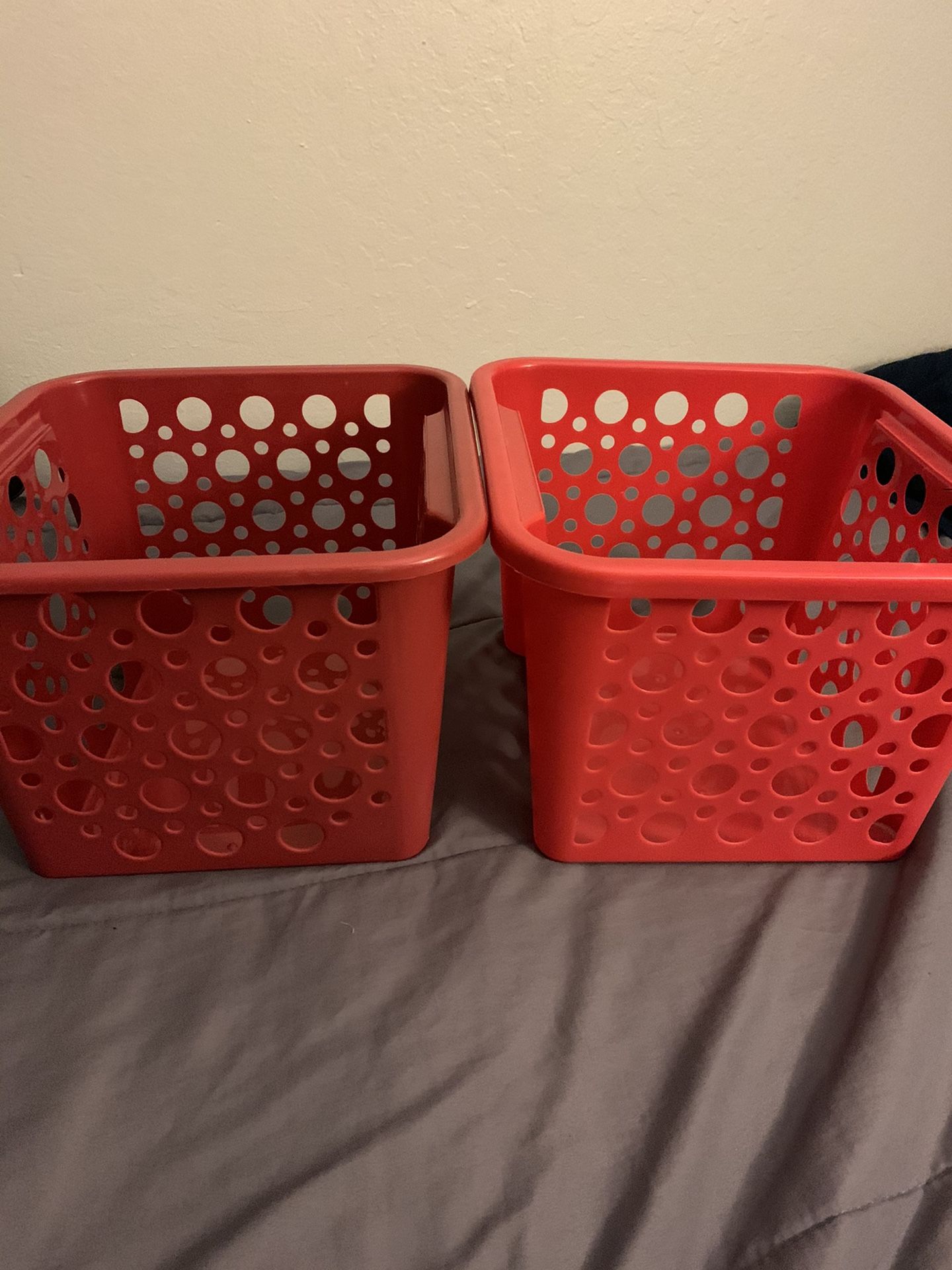 Three red storage containers
