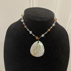Beautiful abalone/mother of pearl Guess brand.