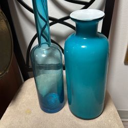 One Is Light Blue Frosted Glass And The Other One Is Clear