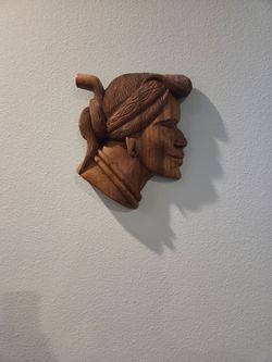 Carved wooden wall sculpture