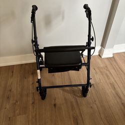 Walker  4 wheels with seat /storage