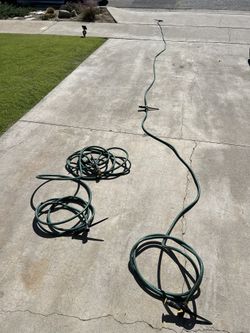 2 Sets Of Melnor Sprinklers