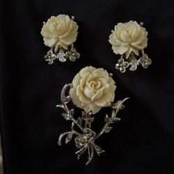 vintage jewelry set from the Lady Coventry Collection, a line of costume jewelry produced by the Sarah Coventry company. This specific demi-parure set