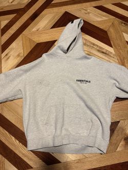 Fear of God Essentials Hoodie in a heather gray