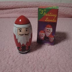 This Christmas Santa Claus Nesting Dolls Set of 3 Wooden Toys Ornaments features a novelty pattern with a small size and multicolor design. Made of wo