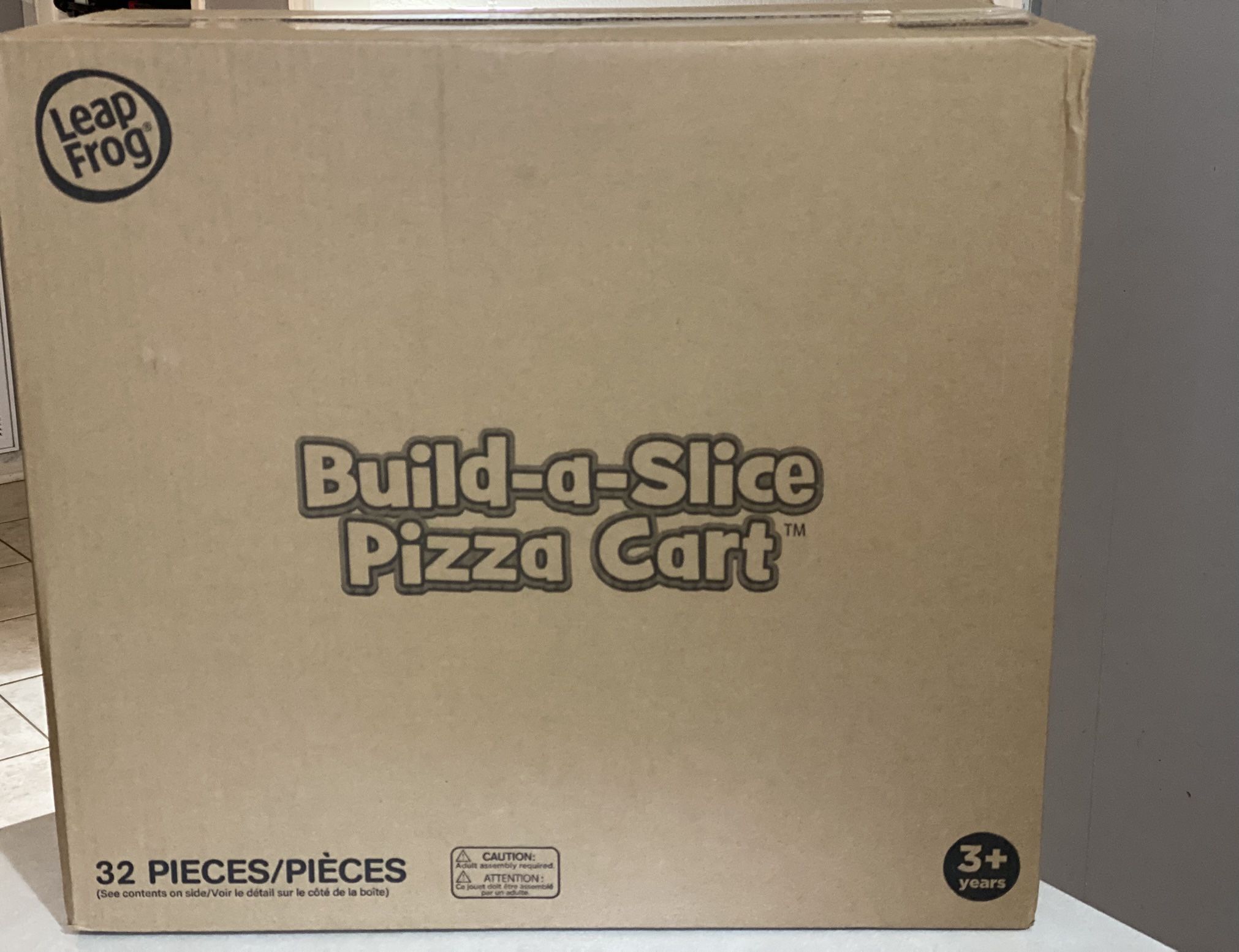 Brand New LeapFrog Build-a-Slice Pizza Cart 32 pieces with music and sounds